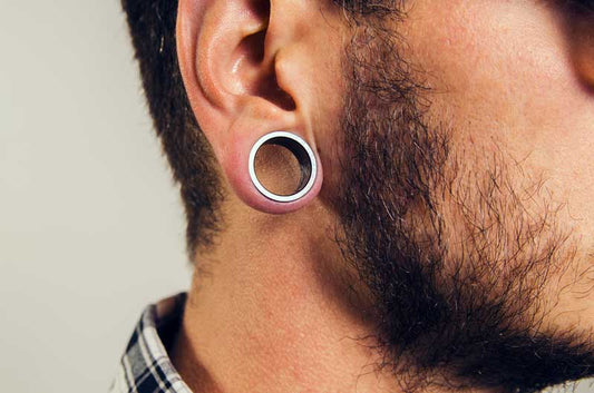 Male with ear gauge